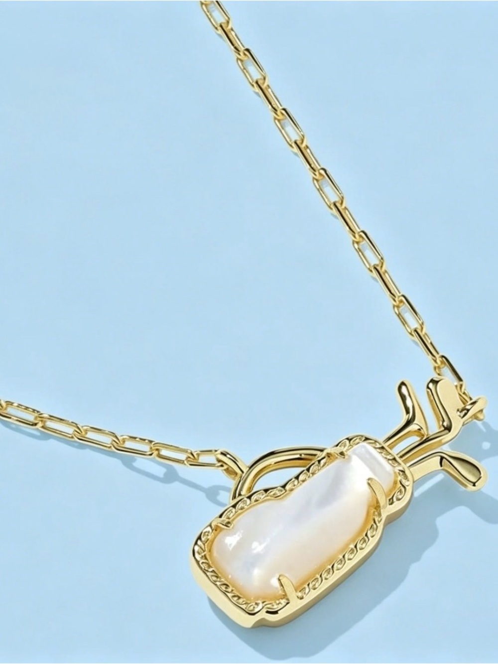 Kendra Scott Gold plated, mother of pearl short pendant golf bag necklace.